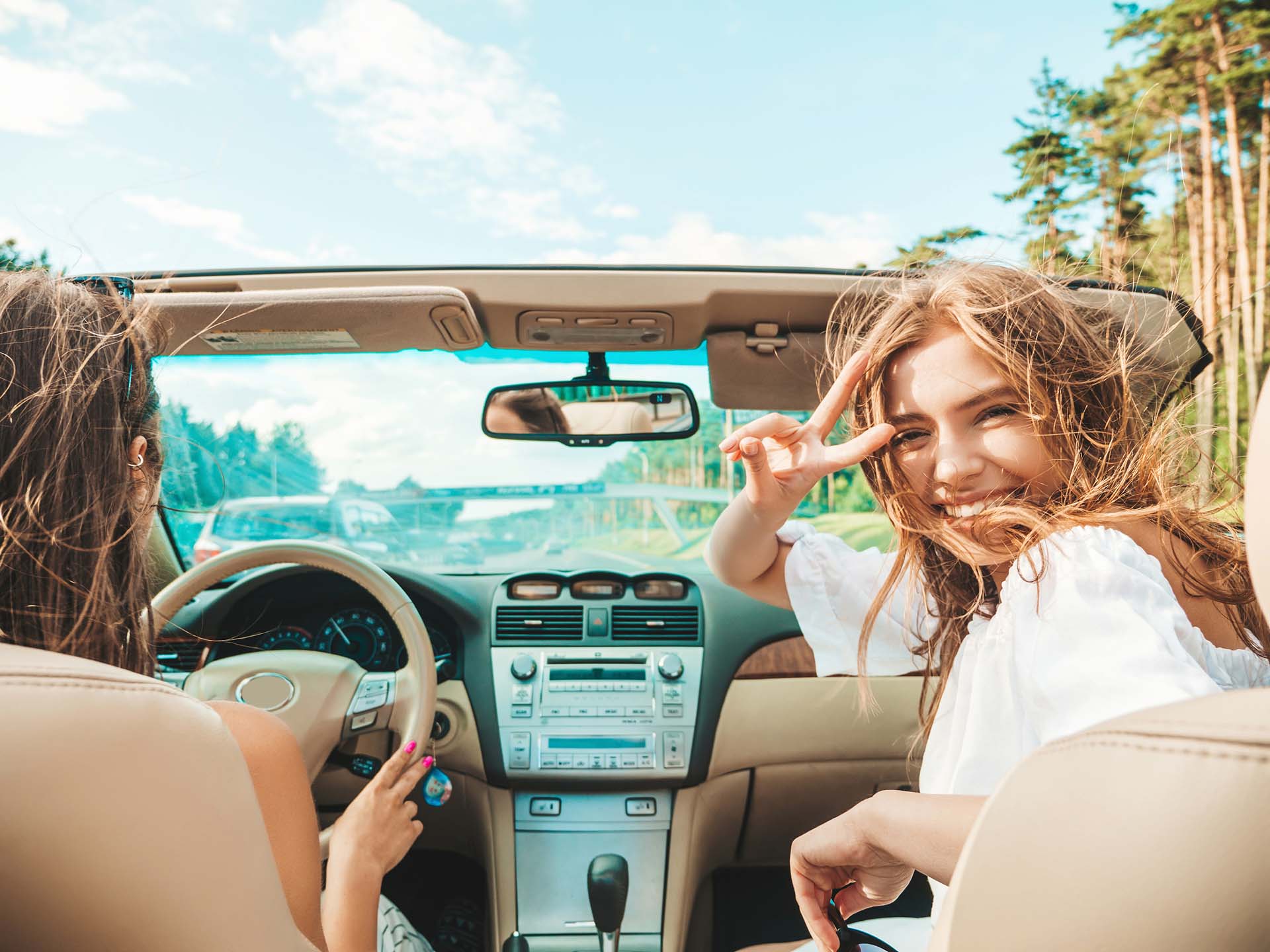 Kokolis Car Rental portrait-two-young-beautiful-smiling-hipster-female-convertible-car- rent-kokolis-kefalonia